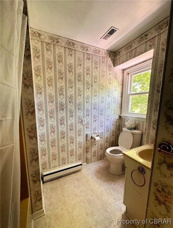 402 N Ivy Ave, Highland Springs, VA 23075 - full bath featuring a baseboard radiator, vanity, and toilet