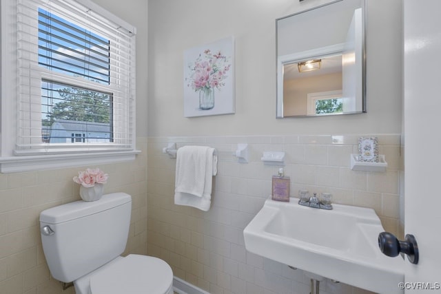 3511 Respess Rd, Midlothian, VA 23112 - bathroom featuring tile walls, toilet, wainscoting, and a sink