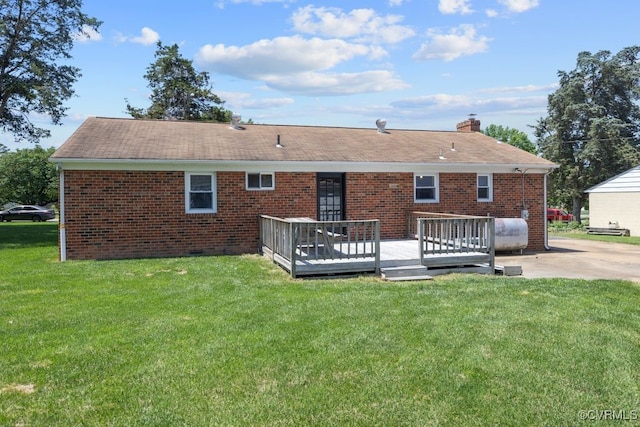 3511 Respess Rd, Midlothian, VA 23112 - rear view of house with a wooden deck, brick siding, a chimney, and a lawn