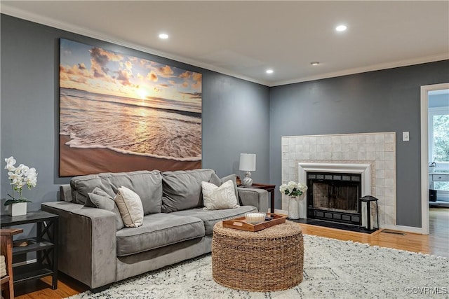 12125 Shore View Dr, Henrico, VA 23233 - living area featuring crown molding, wood finished floors, recessed lighting, and a tile fireplace
