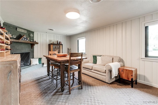 8415 Freestone Ave, Henrico, VA 23229 - carpeted dining area with a decorative wall and a fireplace