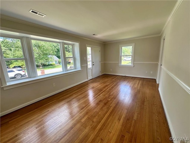 1709 Glenview Rd, Richmond, VA 23222 - spare room with wood finished floors, baseboards, and crown molding