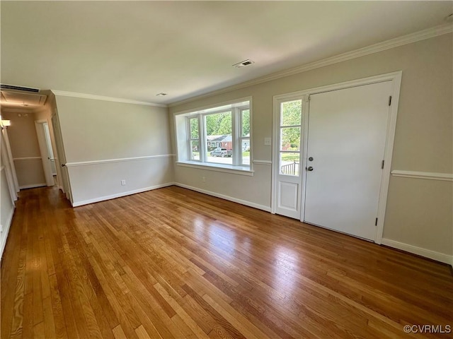 1709 Glenview Rd, Richmond, VA 23222 - unfurnished living room with wood finished floors, baseboards, ornamental molding, and attic access