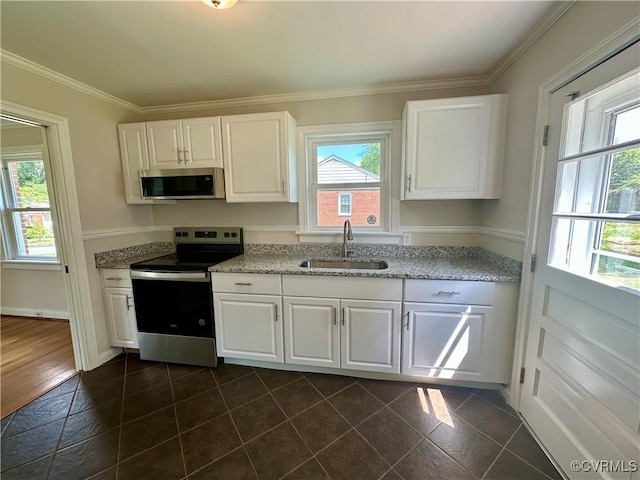 1709 Glenview Rd, Richmond, VA 23222 - kitchen featuring appliances with stainless steel finishes, a sink, plenty of natural light, white cabinetry, and crown molding