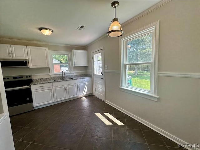 1709 Glenview Rd, Richmond, VA 23222 - kitchen with appliances with stainless steel finishes, white cabinetry, dark tile patterned floors, a sink, and crown molding