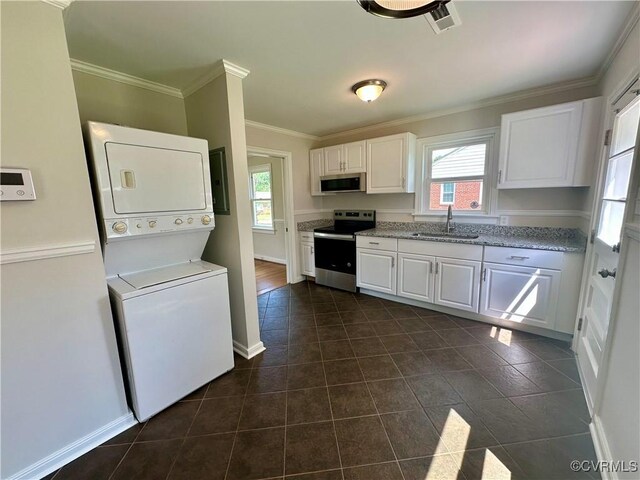 1709 Glenview Rd, Richmond, VA 23222 - kitchen with appliances with stainless steel finishes, a sink, stacked washer and clothes dryer, white cabinets, and ornamental molding