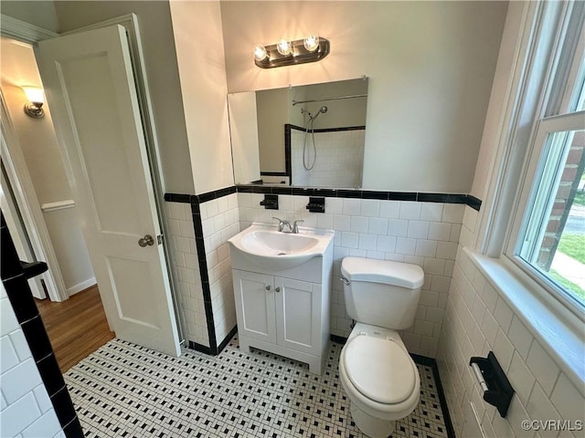 1709 Glenview Rd, Richmond, VA 23222 - bathroom with tile walls, vanity, toilet, and wainscoting