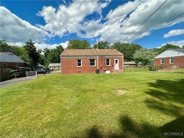 1709 Glenview Rd, Richmond, VA 23222 - rear view of house with crawl space, brick siding, cooling unit, and entry steps