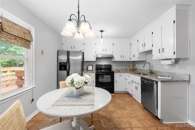 12203 King Cotton Ct, Midlothian, VA 23112 - kitchen with appliances with stainless steel finishes, under cabinet range hood, a chandelier, radiator heating unit, and white cabinetry
