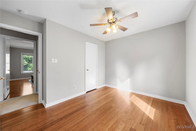 12203 King Cotton Ct, Midlothian, VA 23112 - spare room with a smoke detector, a ceiling fan, baseboards, and wood finished floors