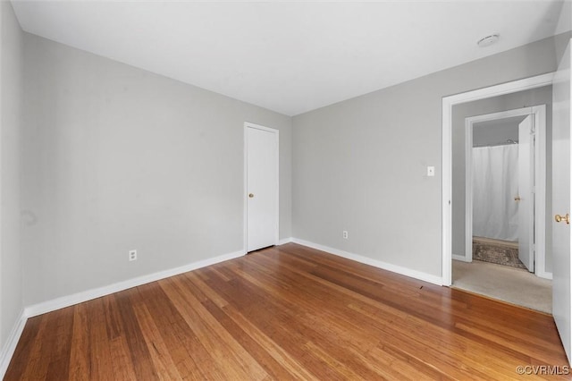 12203 King Cotton Ct, Midlothian, VA 23112 - unfurnished room with baseboards and wood finished floors
