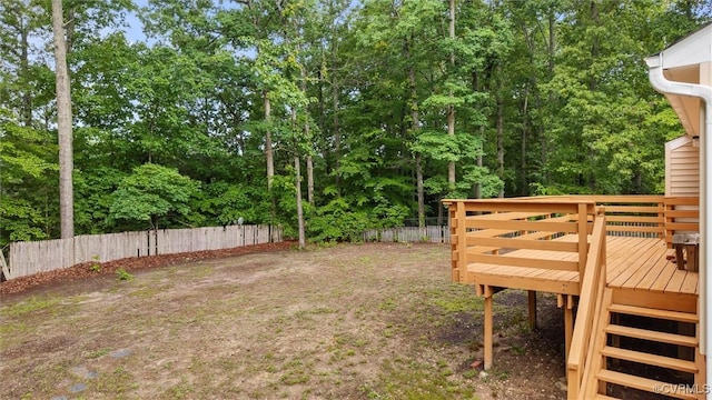 12203 King Cotton Ct, Midlothian, VA 23112 - fenced backyard with a deck and view of wooded area