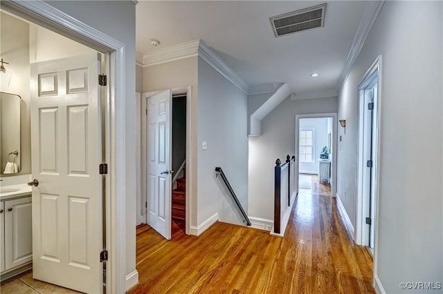 3006 Calcutt Dr, Midlothian, VA 23113 - corridor featuring an upstairs landing, crown molding, and light wood finished floors