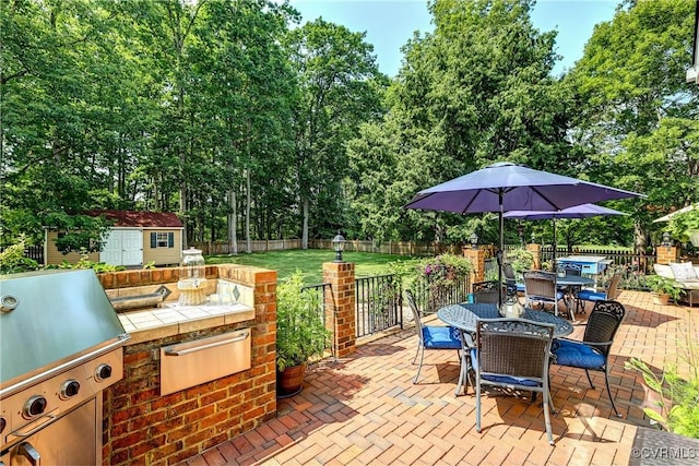 3006 Calcutt Dr, Midlothian, VA 23113 - fenced backyard featuring outdoor dining space, a patio area, a storage shed, and a grill