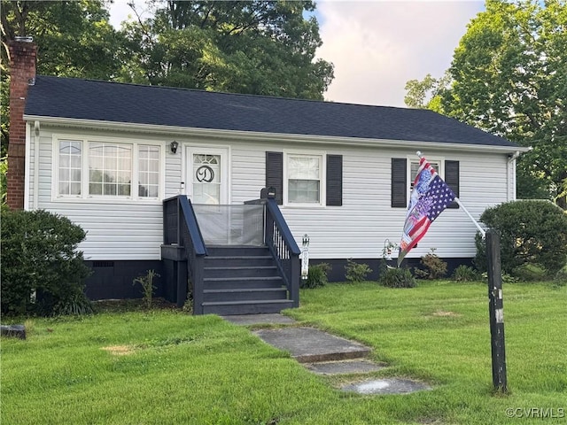 3530 Gilbert St, Hopewell, VA 23860 - view of front of home with a front lawn, crawl space, and a chimney