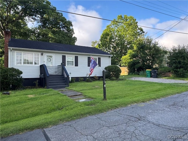 3530 Gilbert St, Hopewell, VA 23860 - view of front of house featuring a front yard and a chimney
