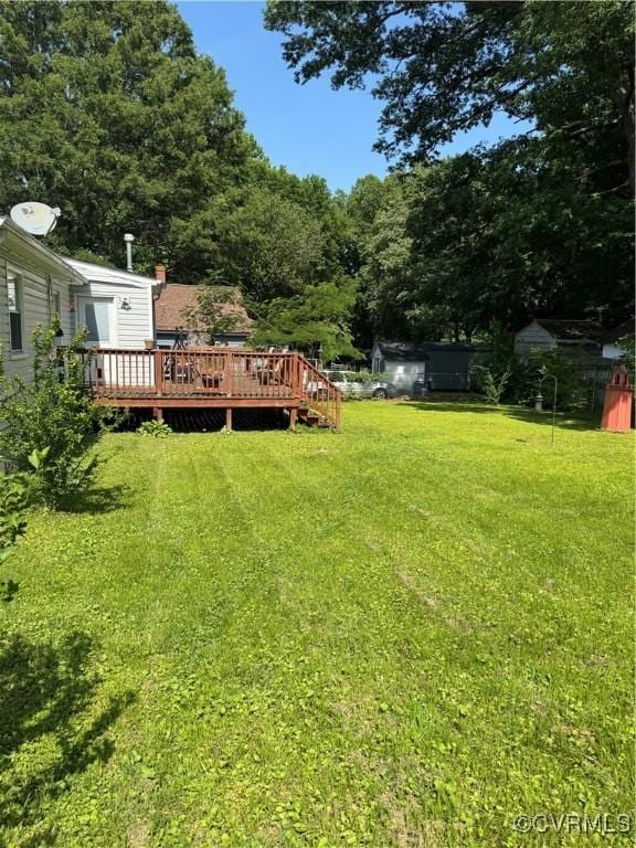 3530 Gilbert St, Hopewell, VA 23860 - view of green lawn featuring a wooden deck