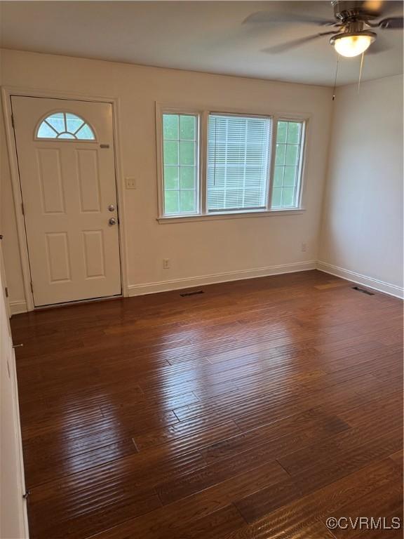 3530 Gilbert St, Hopewell, VA 23860 - foyer entrance featuring dark wood-type flooring, healthy amount of natural light, and a ceiling fan