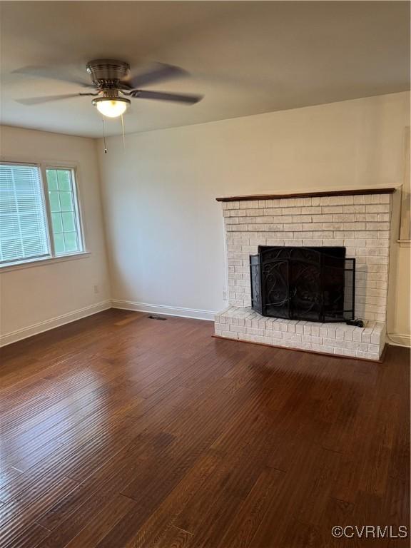 3530 Gilbert St, Hopewell, VA 23860 - unfurnished living room with a fireplace, wood finished floors, and a ceiling fan