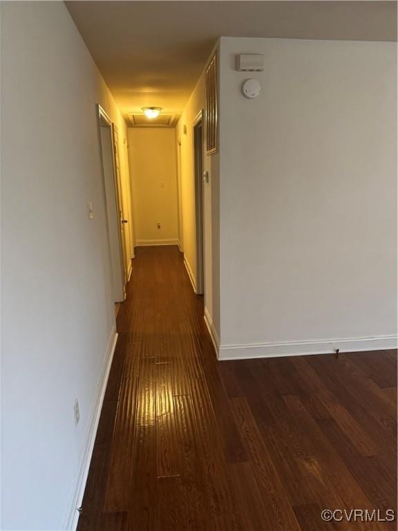 3530 Gilbert St, Hopewell, VA 23860 - corridor featuring attic access and dark wood-style flooring