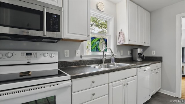 2207 Marroit Rd, Henrico, VA 23229 - kitchen featuring white appliances, a sink, white cabinetry, and dark countertops