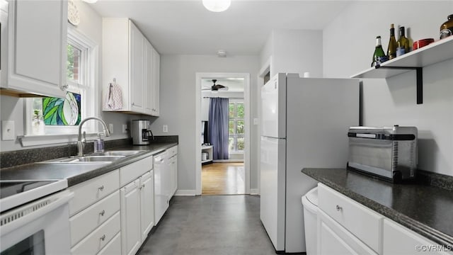 2207 Marroit Rd, Henrico, VA 23229 - kitchen featuring white appliances, dark countertops, and white cabinets