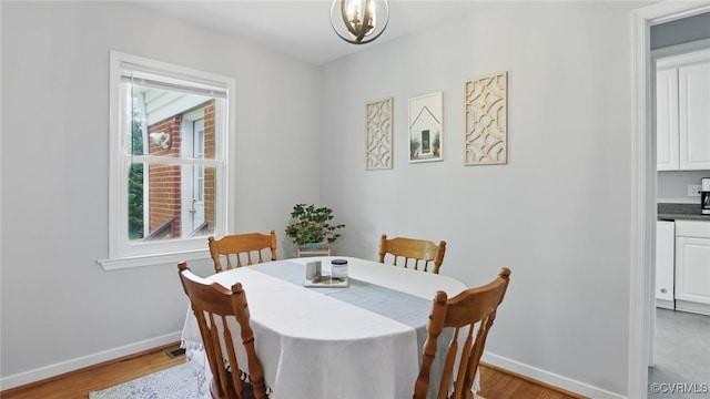2207 Marroit Rd, Henrico, VA 23229 - dining area featuring light wood-style flooring and a chandelier