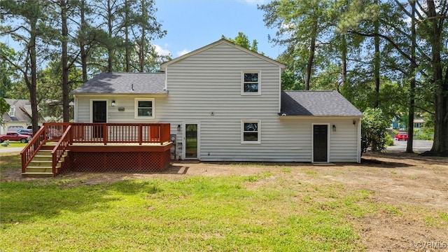 1121 Collingwood Dr, North Prince George, VA 23860 - rear view of house featuring a deck, a lawn, and a shingled roof