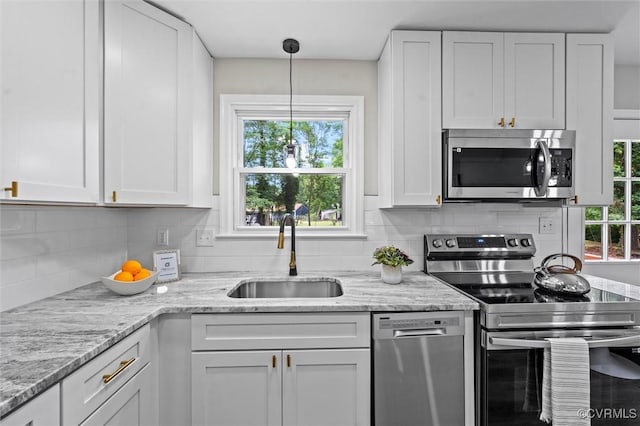 1121 Collingwood Dr, North Prince George, VA 23860 - kitchen featuring appliances with stainless steel finishes, a sink, white cabinets, and decorative backsplash