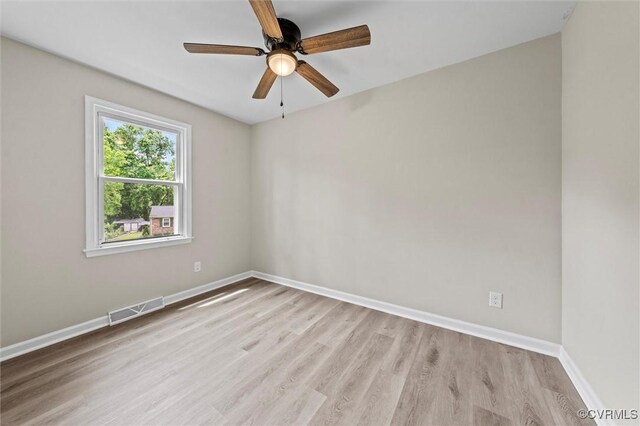 1121 Collingwood Dr, North Prince George, VA 23860 - unfurnished room featuring wood finished floors, a ceiling fan, and baseboards