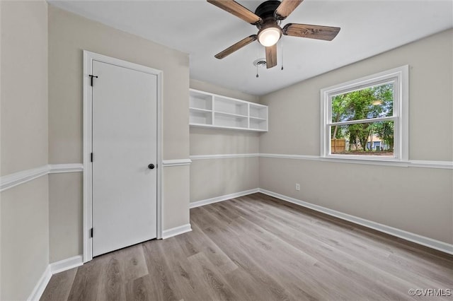 1121 Collingwood Dr, North Prince George, VA 23860 - empty room featuring wood finished floors, a ceiling fan, and baseboards