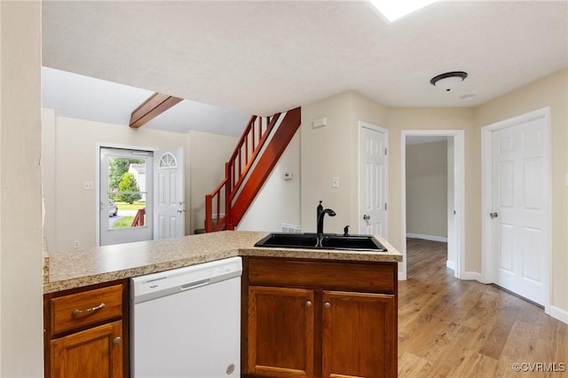 8418 Scottingham Ct, North Chesterfield, VA 23236 - kitchen with white dishwasher, a sink, light wood-style floors, a peninsula, and light countertops