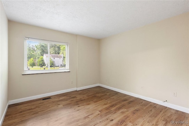 8418 Scottingham Ct, North Chesterfield, VA 23236 - empty room with wood finished floors, a textured ceiling, and baseboards