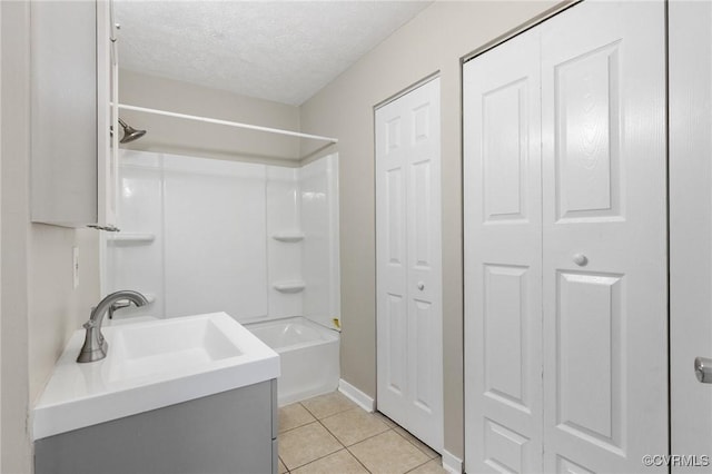 8418 Scottingham Ct, North Chesterfield, VA 23236 - bathroom with a closet, tub / shower combination, tile patterned floors, a textured ceiling, and vanity