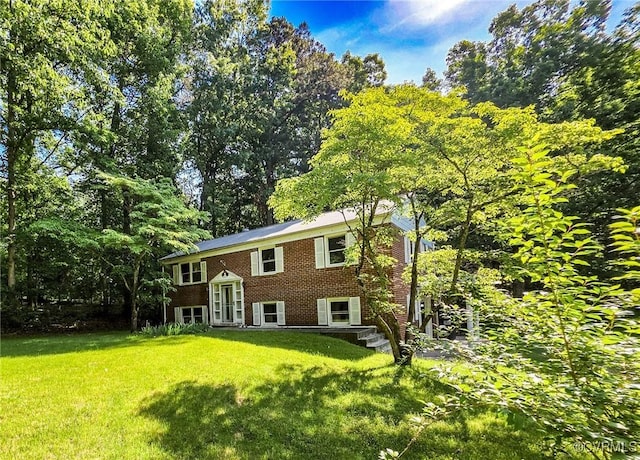 16121 Rowlett Rd, Chesterfield, VA 23838 - rear view of property with brick siding and a lawn