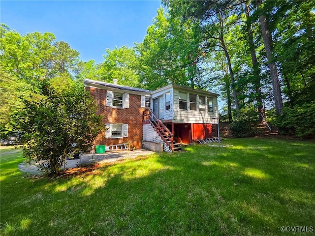 16121 Rowlett Rd, Chesterfield, VA 23838 - back of house with stairs, brick siding, a lawn, and a patio area