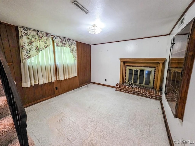 16121 Rowlett Rd, Chesterfield, VA 23838 - unfurnished living room with tile patterned floors, a fireplace, baseboards, and wooden walls