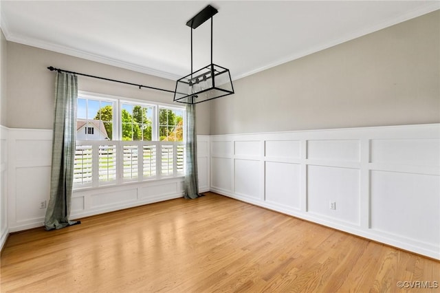 4824 Hilbay Ter, Moseley, VA 23120 - unfurnished dining area with a decorative wall, a chandelier, crown molding, light wood-style floors, and a wainscoted wall