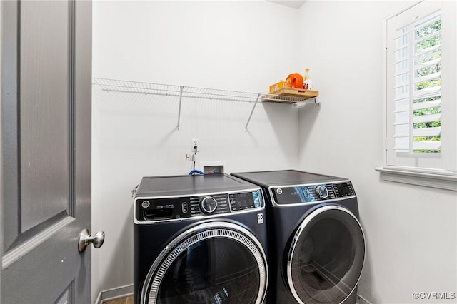 4824 Hilbay Ter, Moseley, VA 23120 - washroom with washer and clothes dryer, healthy amount of natural light, and baseboards