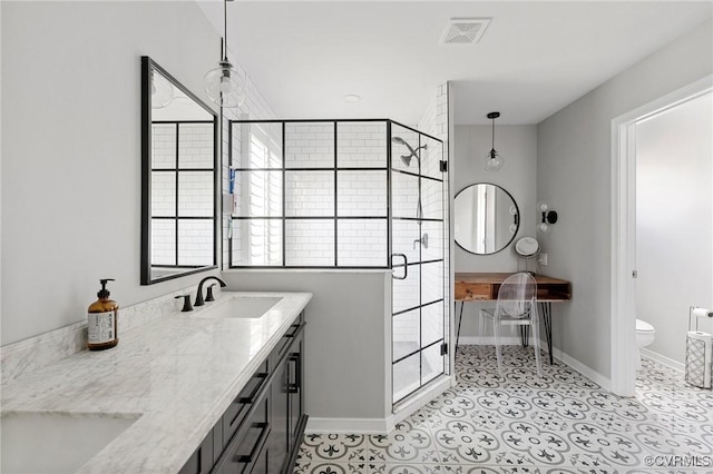4824 Hilbay Ter, Moseley, VA 23120 - bathroom featuring a stall shower, toilet, double vanity, and baseboards