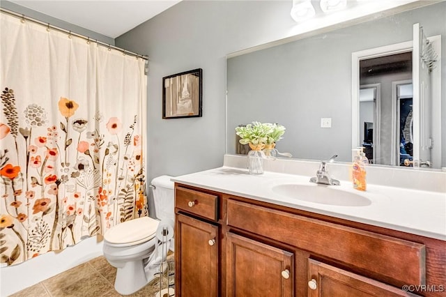 506 N 28th St, Richmond, VA 23223 - bathroom with toilet, vanity, and tile patterned floors