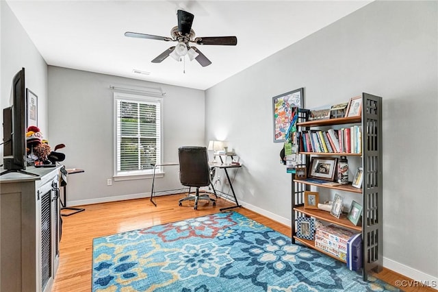 506 N 28th St, Richmond, VA 23223 - office area with wood finished floors, a ceiling fan, and baseboards