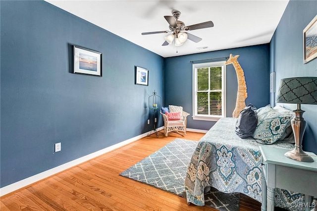 506 N 28th St, Richmond, VA 23223 - bedroom featuring wood finished floors, baseboards, and a ceiling fan