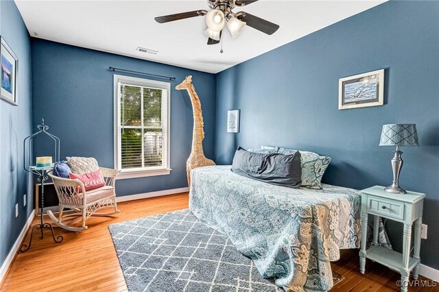506 N 28th St, Richmond, VA 23223 - bedroom with baseboards and wood finished floors