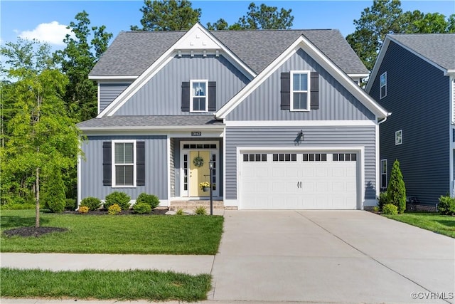 13042 Fieldfare Dr, Midlothian, VA 23112 - view of front facade with board and batten siding, driveway, a shingled roof, and a front yard