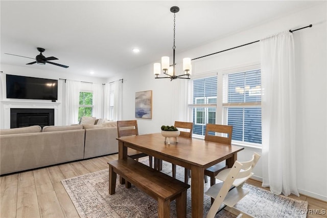 15637 Cedarville Dr, Midlothian, VA 23112 - dining space featuring a chandelier, light wood-style floors, ceiling fan, a glass covered fireplace, and recessed lighting