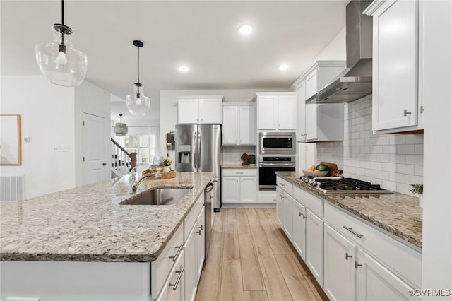 15637 Cedarville Dr, Midlothian, VA 23112 - kitchen with stainless steel appliances, wall chimney exhaust hood, a sink, white cabinetry, and tasteful backsplash
