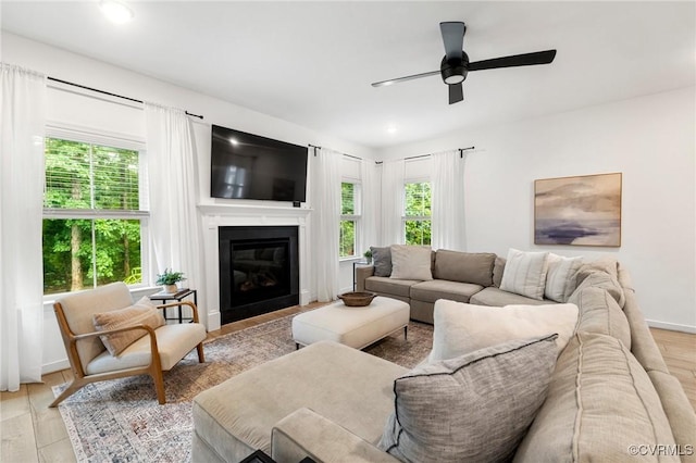 15637 Cedarville Dr, Midlothian, VA 23112 - living area featuring a ceiling fan, a glass covered fireplace, light wood-type flooring, recessed lighting, and baseboards
