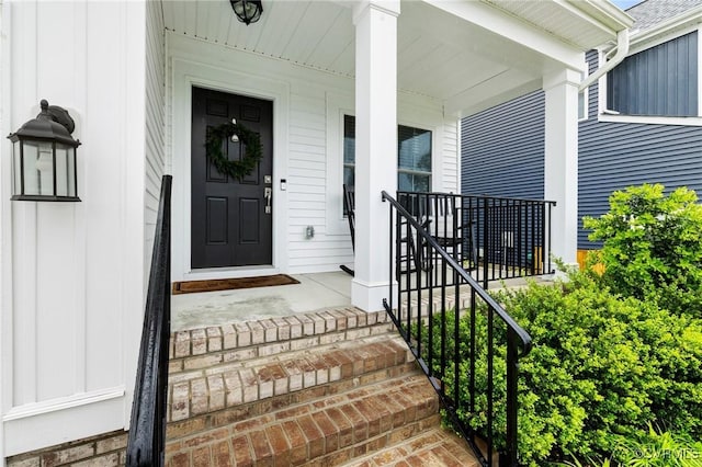 15637 Cedarville Dr, Midlothian, VA 23112 - property entrance with a porch and board and batten siding