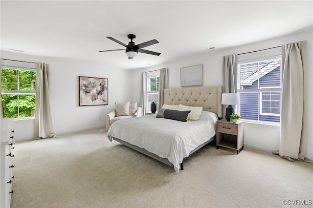 15637 Cedarville Dr, Midlothian, VA 23112 - bedroom with multiple windows, light colored carpet, ceiling fan, and baseboards